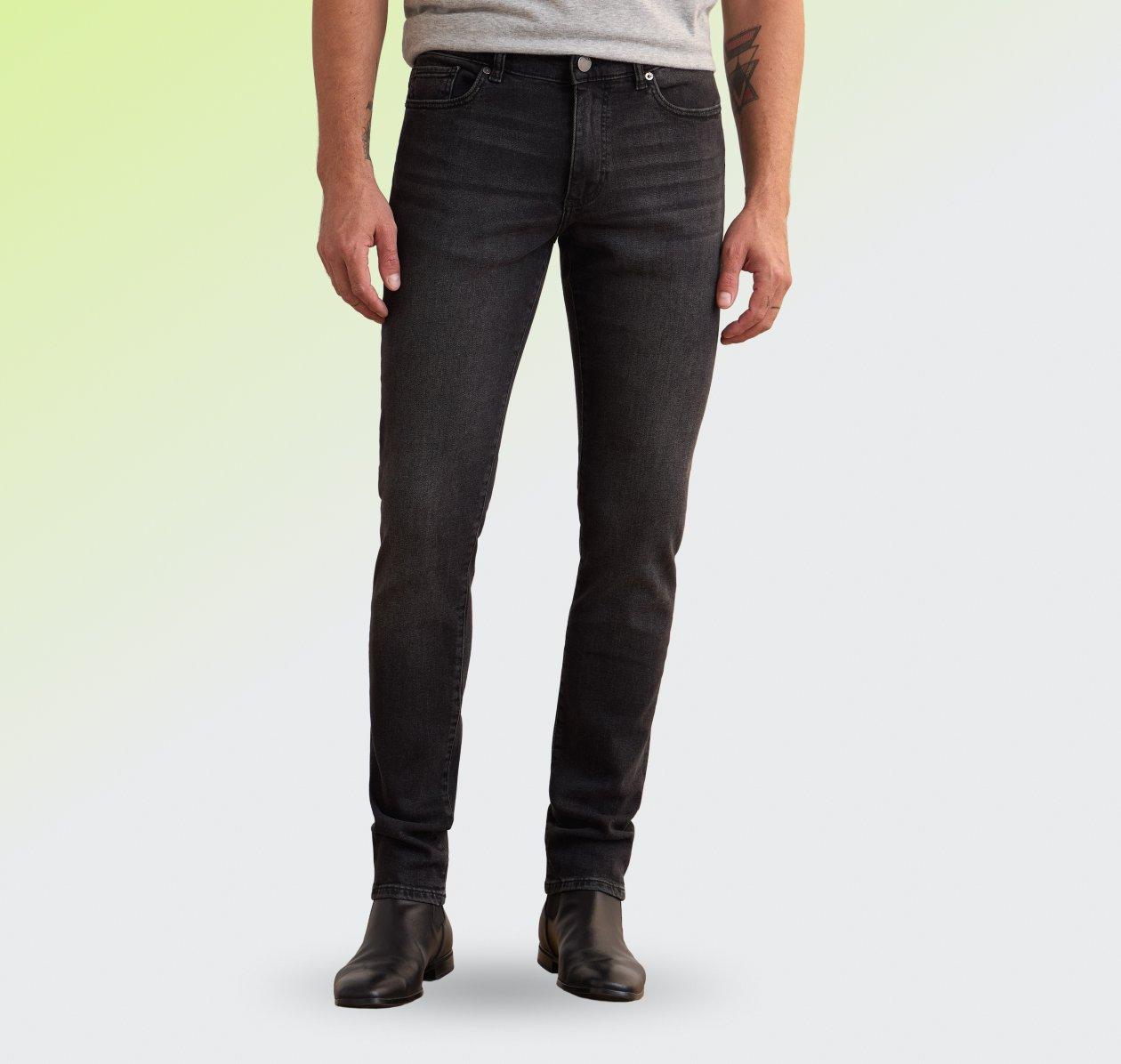  A model wearing Denim in a slim black fit with a subtle striped pattern