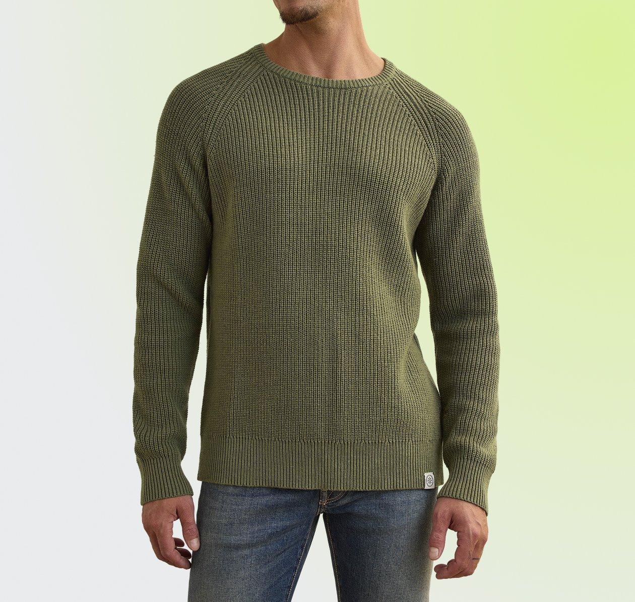 An olive crew neck sweater with a textured ribbed pattern and long sleeves