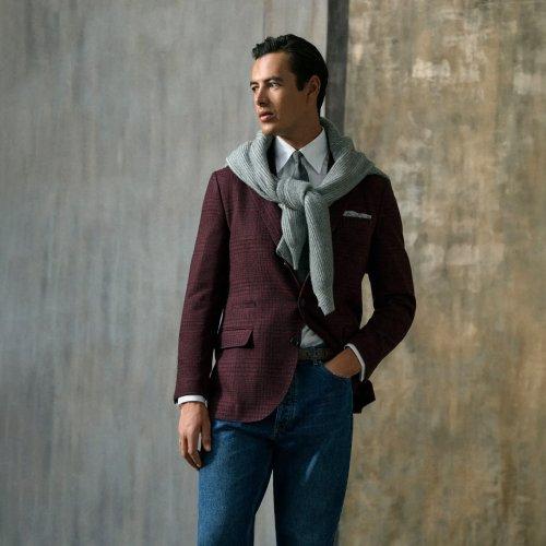 Man wearing a burgundy check blazer