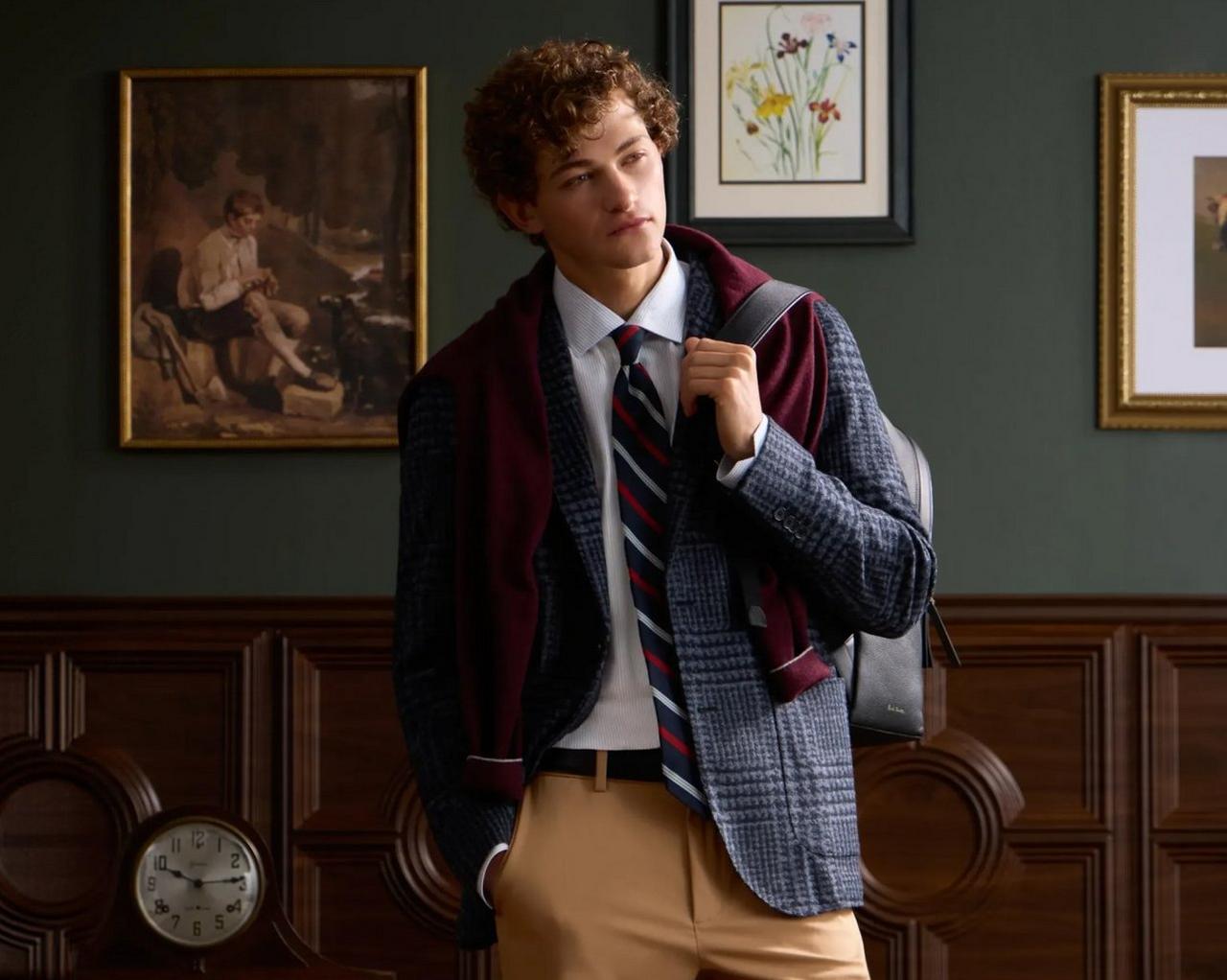 model in school uniform with a maroon sweater draped