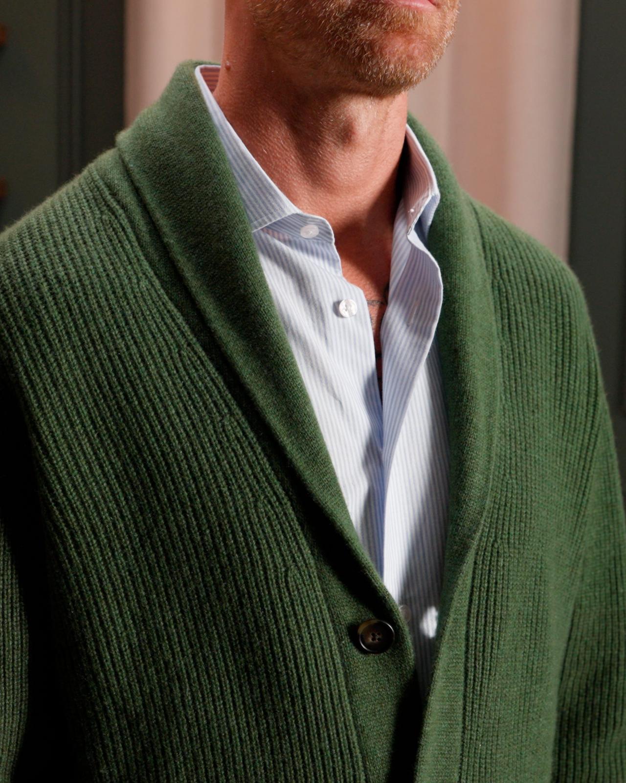 closeup shot of model wearing a green V-neck cardigan