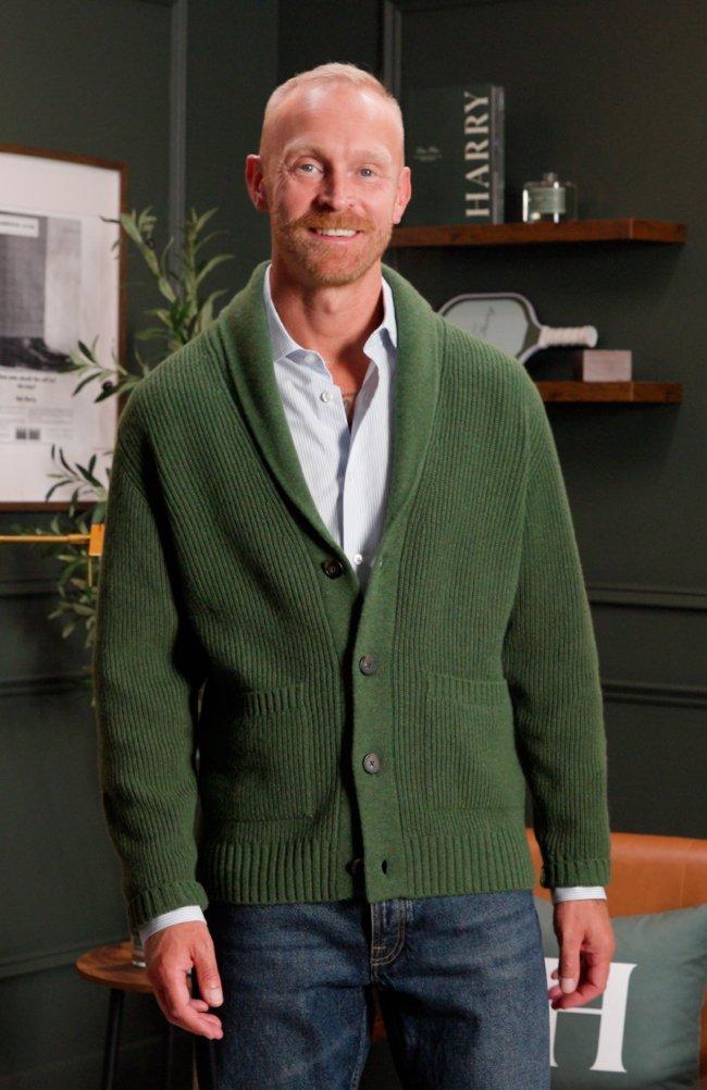 model wearing a green V-neck cardigan