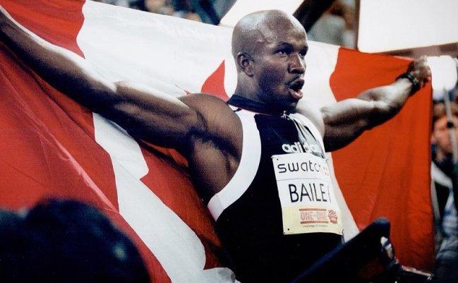 Donovan Bailey, Canada's greatest athlete holding Canada Flag 