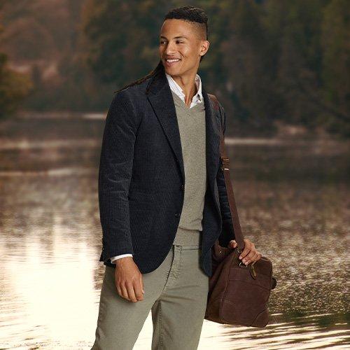Male model wearing corduroy sport jacket emphasizing fall fabric focus