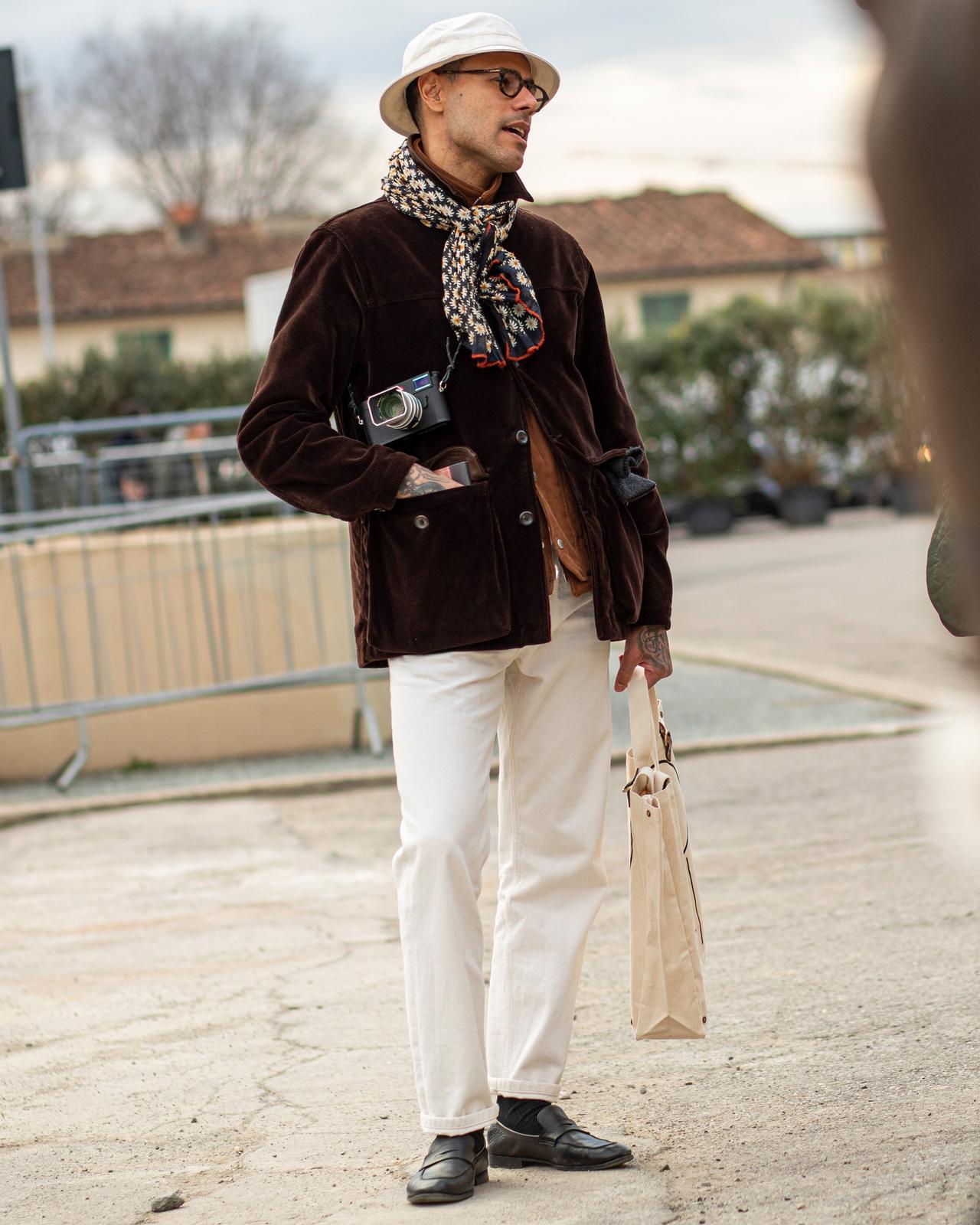 Male wearing layered look in beige and cream