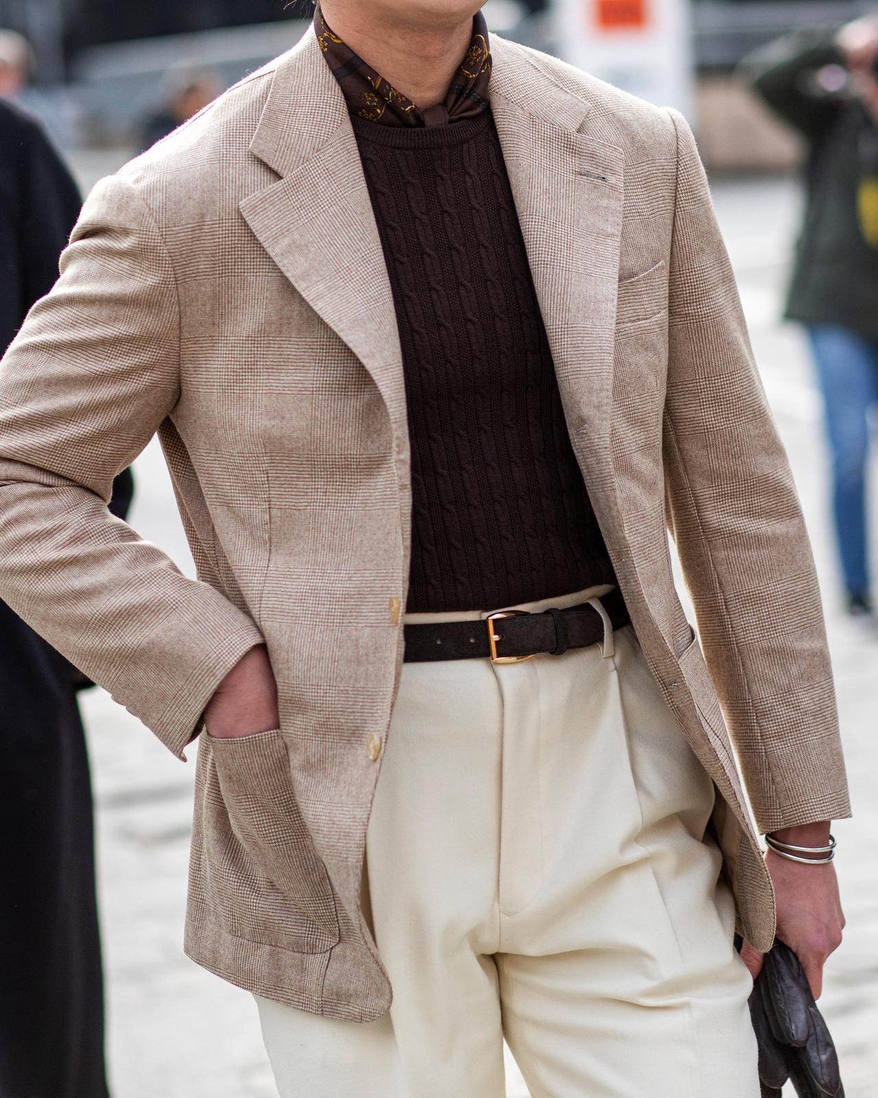 Male wearing layered look in beige and cream