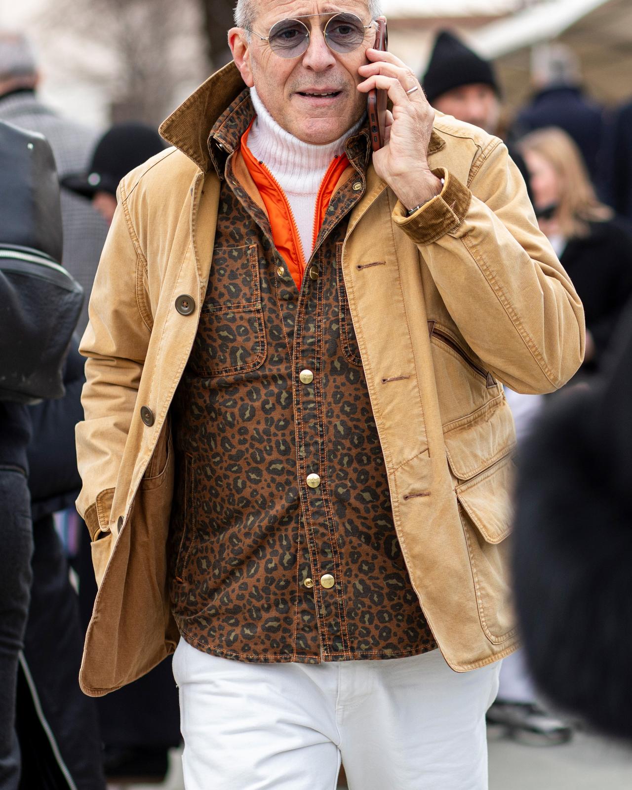 Male wearing layered look in beige and cream