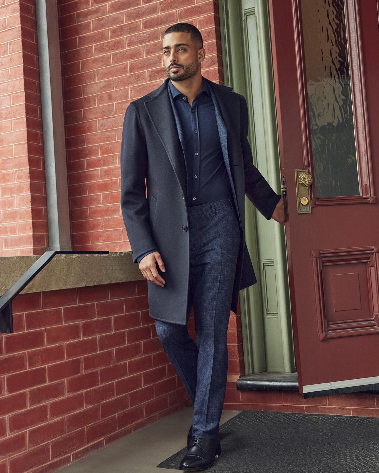 Male model wearing Canali overcoat illustrating fw24 looks