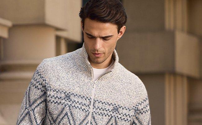 A man wearing a lightweight sweater