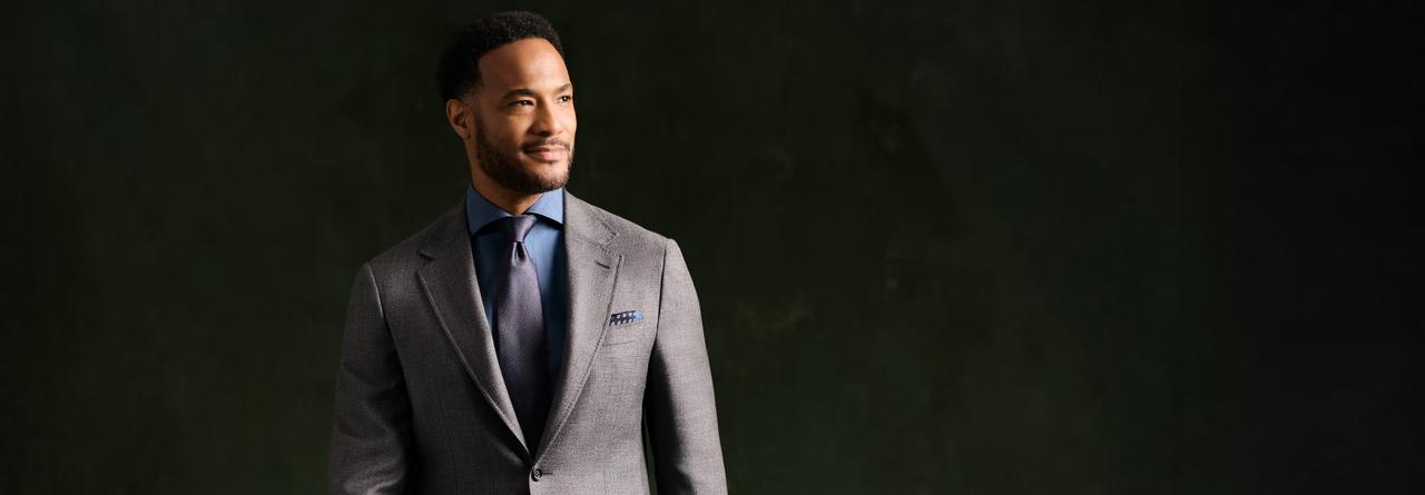 Male model wearing a grey Canali suit