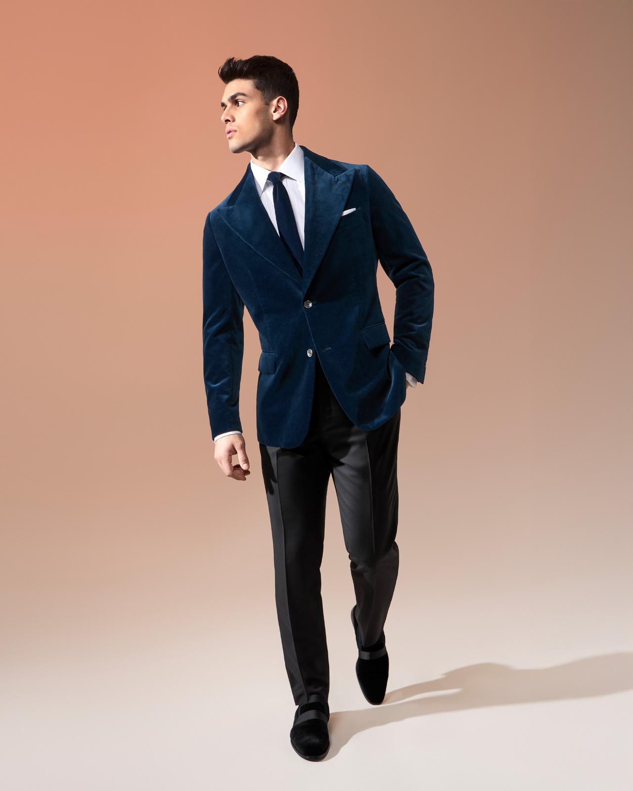 Male model wearing navy velvet tuxedo jacket