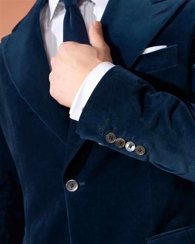 Male model wearing velvet navy dinner jacket