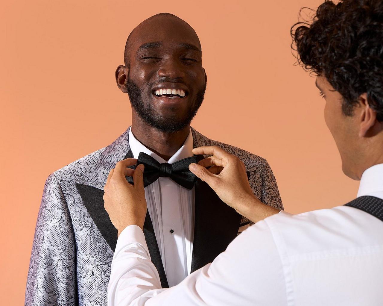 Male model in tailored made-to-measure Harold getting bow tie adjusted