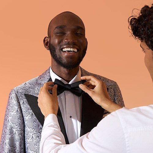 Male model in tailored made-to-measure Harold getting bow tie adjusted