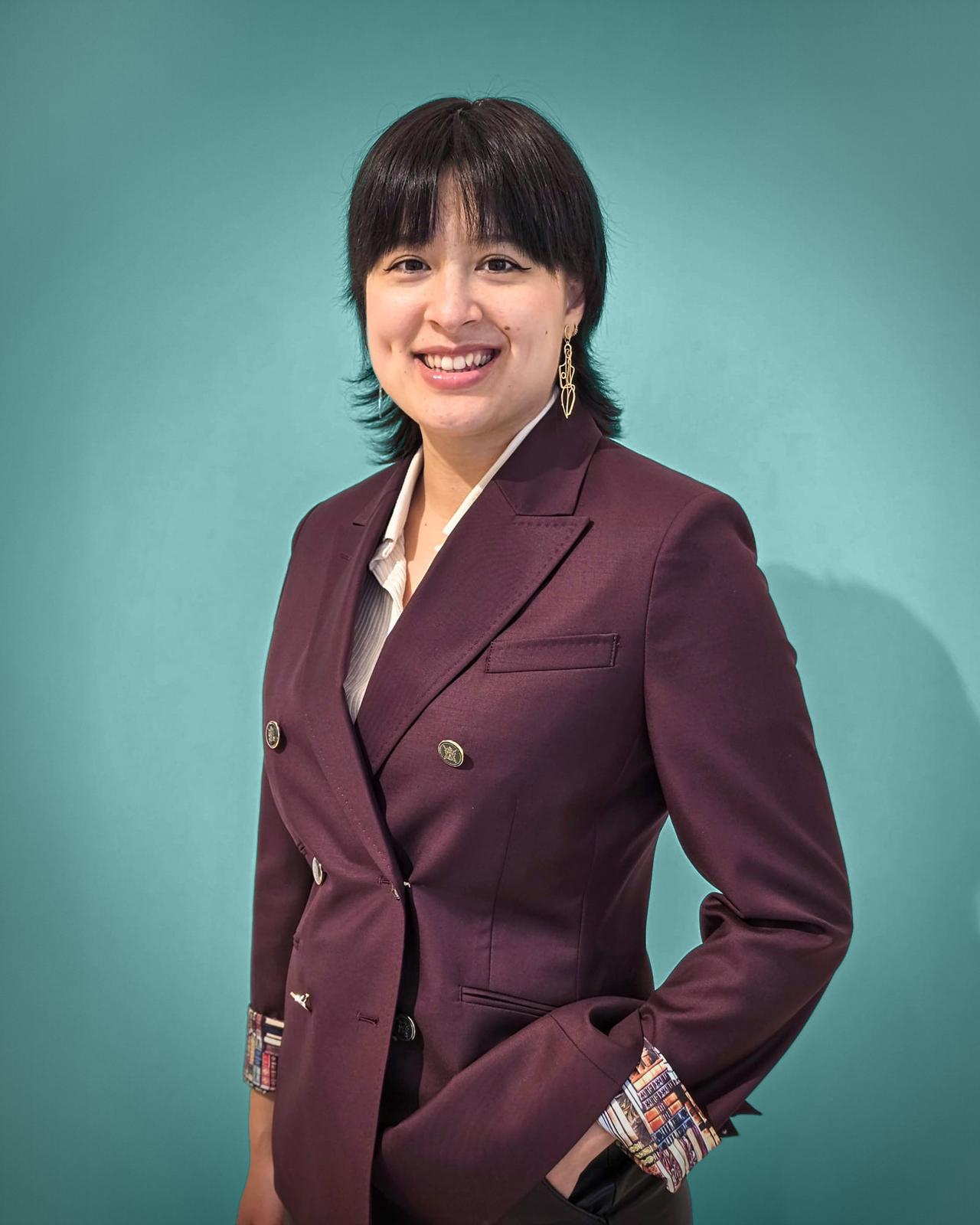 Sumiko Haley on a coloured blue background