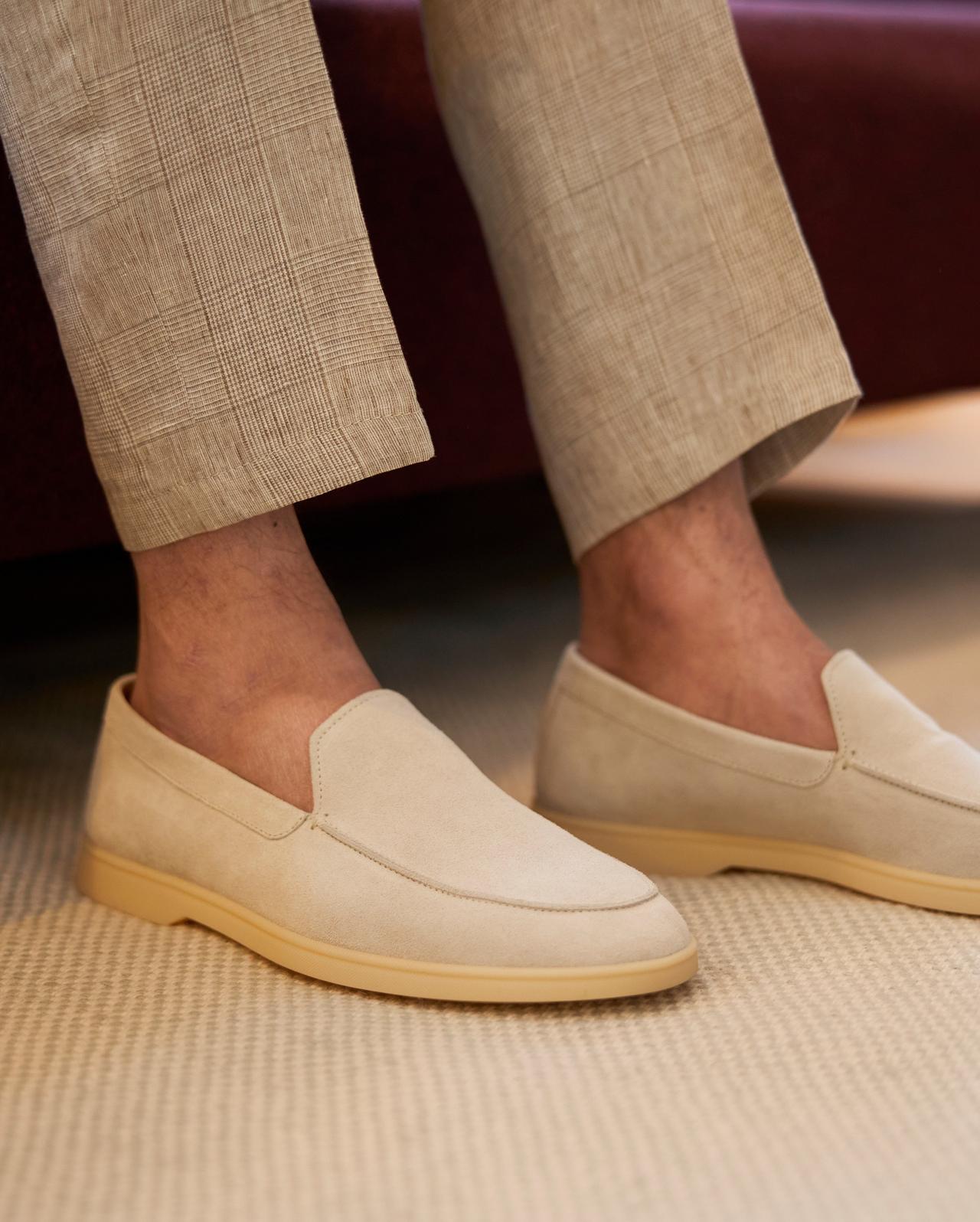 Pair of cream white sole loafers