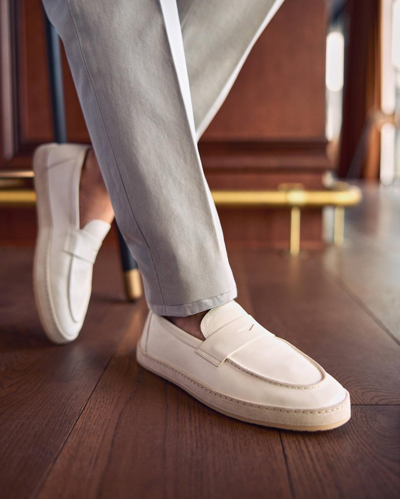 Pair of white sole loafers