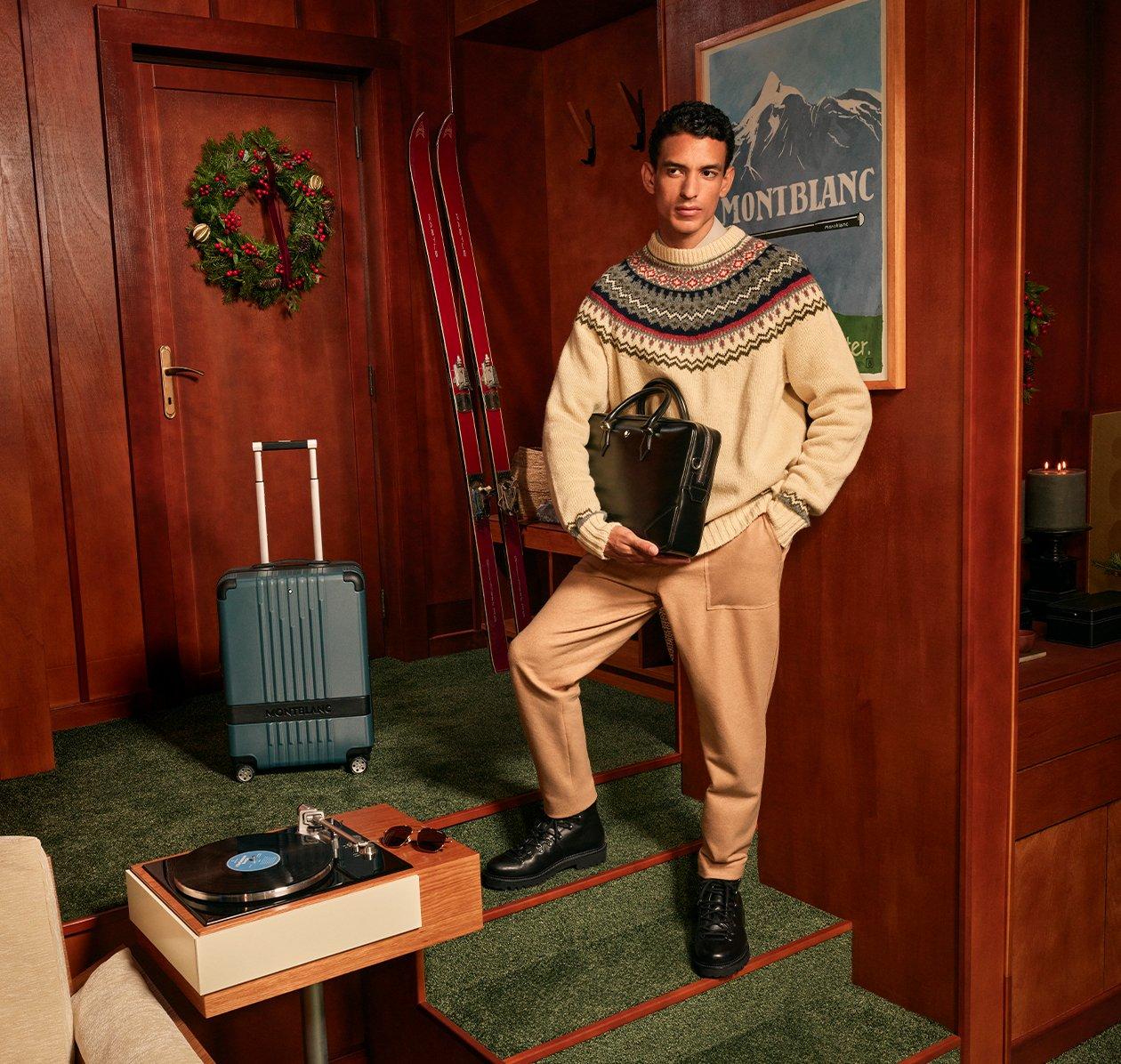 Male model holding Montblanc briefcase illustrating Montblanc holiday gifts