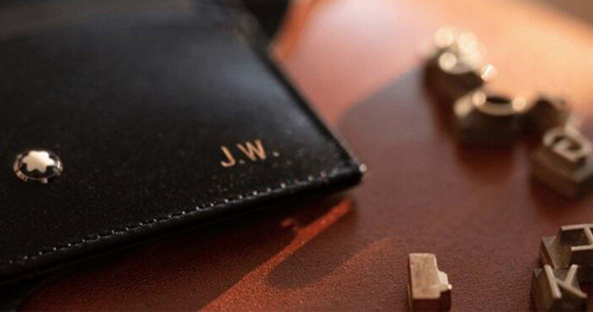 a close up of a wallet with letters spelling out the word jw