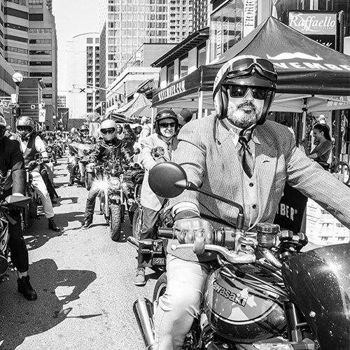 group of men on motorcyles in the city