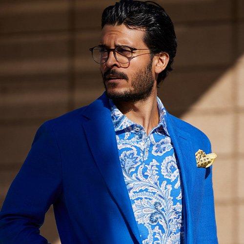 Man wearing blue linen sports jacket and dress shirt