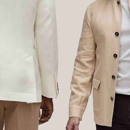 Two men wearing beige jackets and black pants standing next to each other