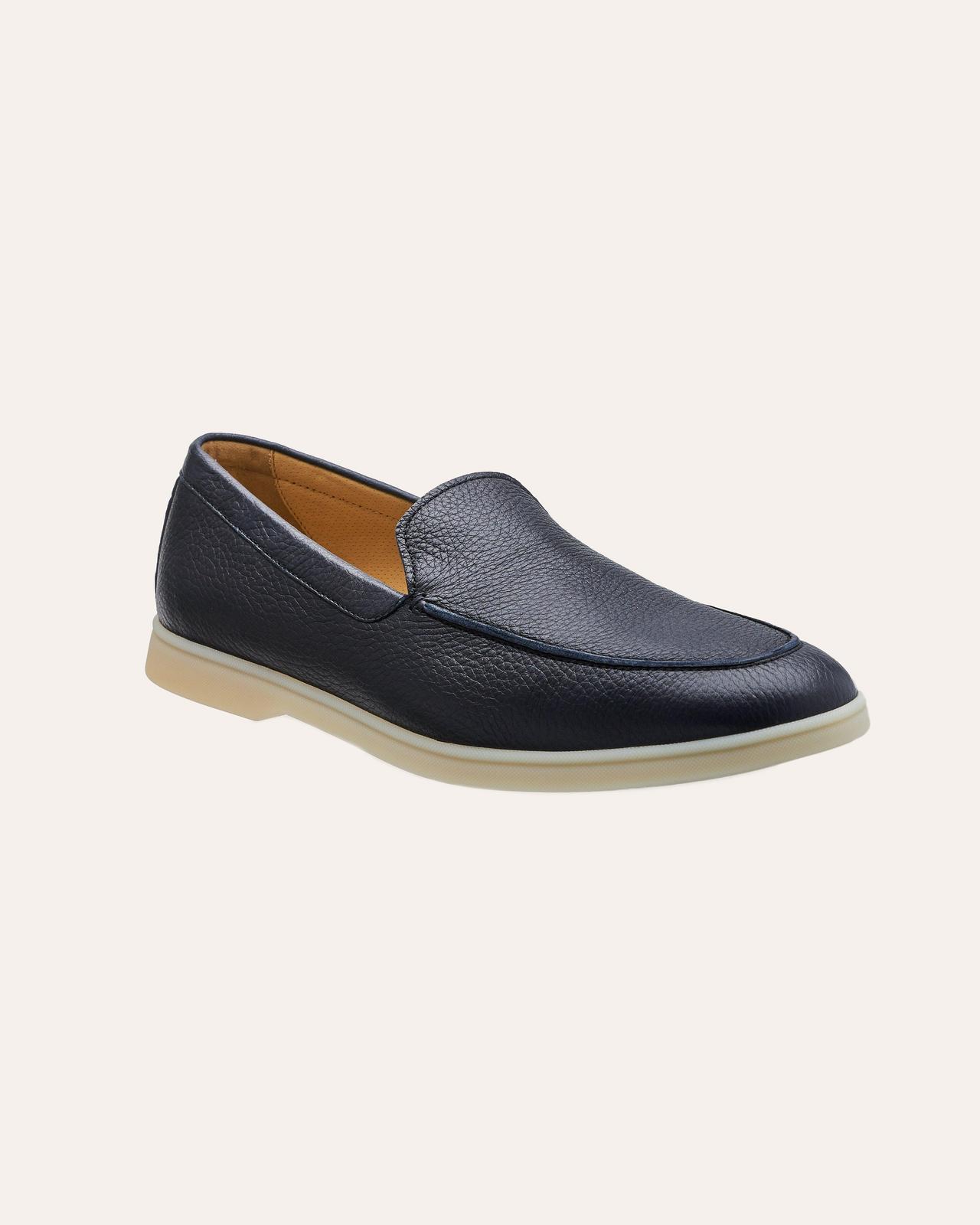 pebbled deerskin leather loafer on beige background