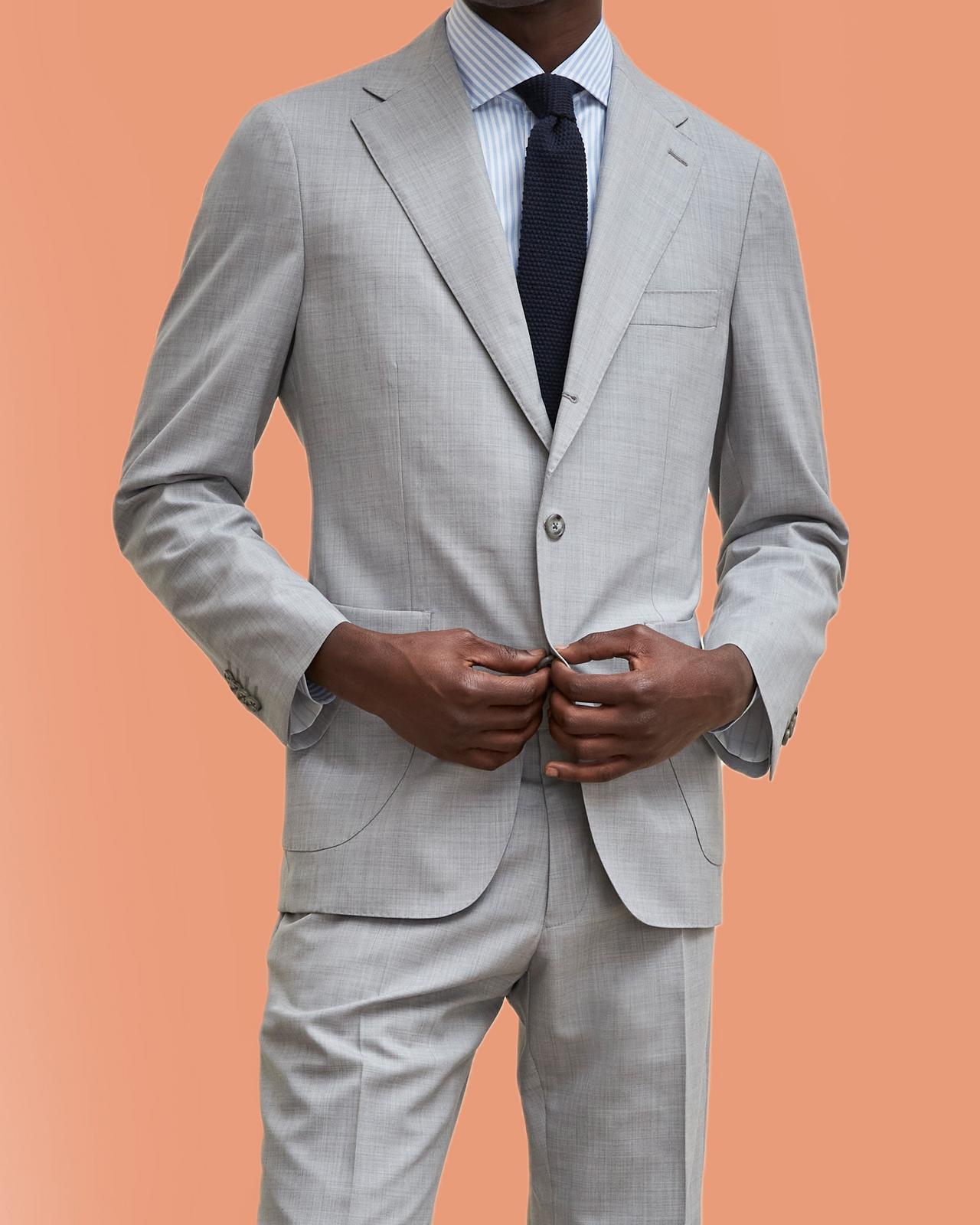 Male model wear a grey Harold suit at Harry Rosen