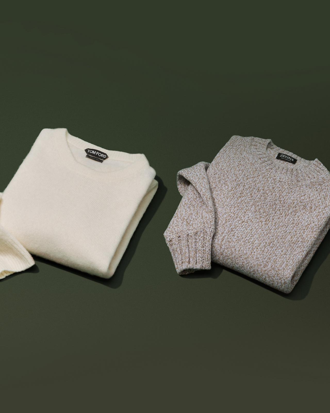 Two sweaters displayed symbolizing holiday season layering