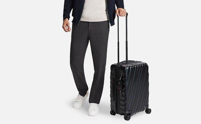 Male walking with luggage