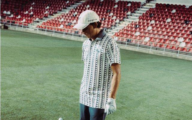 Male wearing golf outfit signifying Reigning Champ x Puma