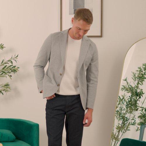 Male model wearing sport jacket, t-shirt and pants signifying how to dress business casual
