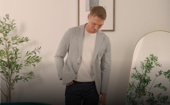 Male model wearing sport jacket, t-shirt and pants signifying how to dress business casual