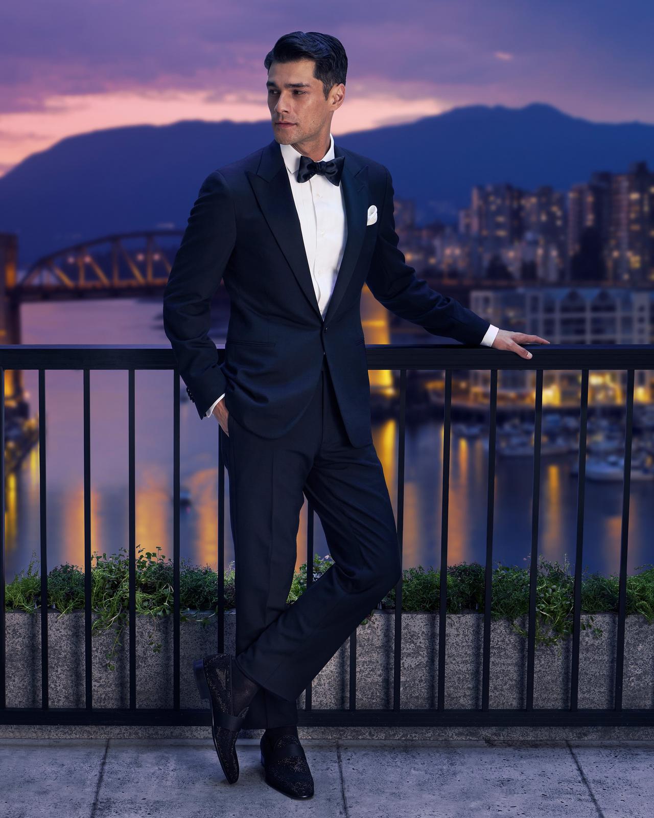 Male model wearing black tuxedo