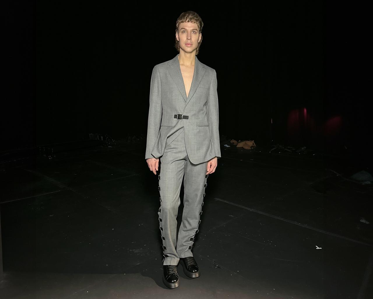 Brook Lyn Hytes wearing a grey suit
