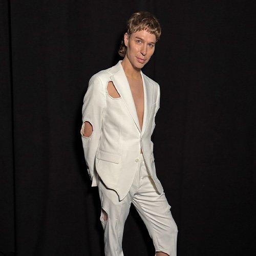 Brook Lyn Hytes wearing a custom made Harold white suit