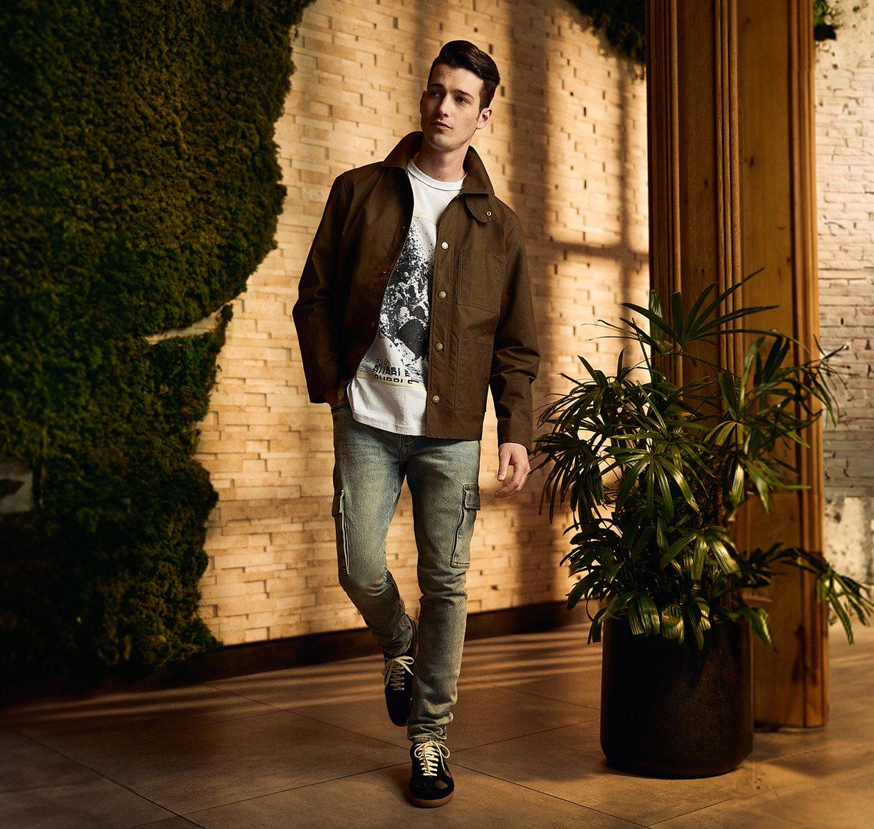 Male model wearing jacket, t-shirt and jeans signifying clothes for any occasion