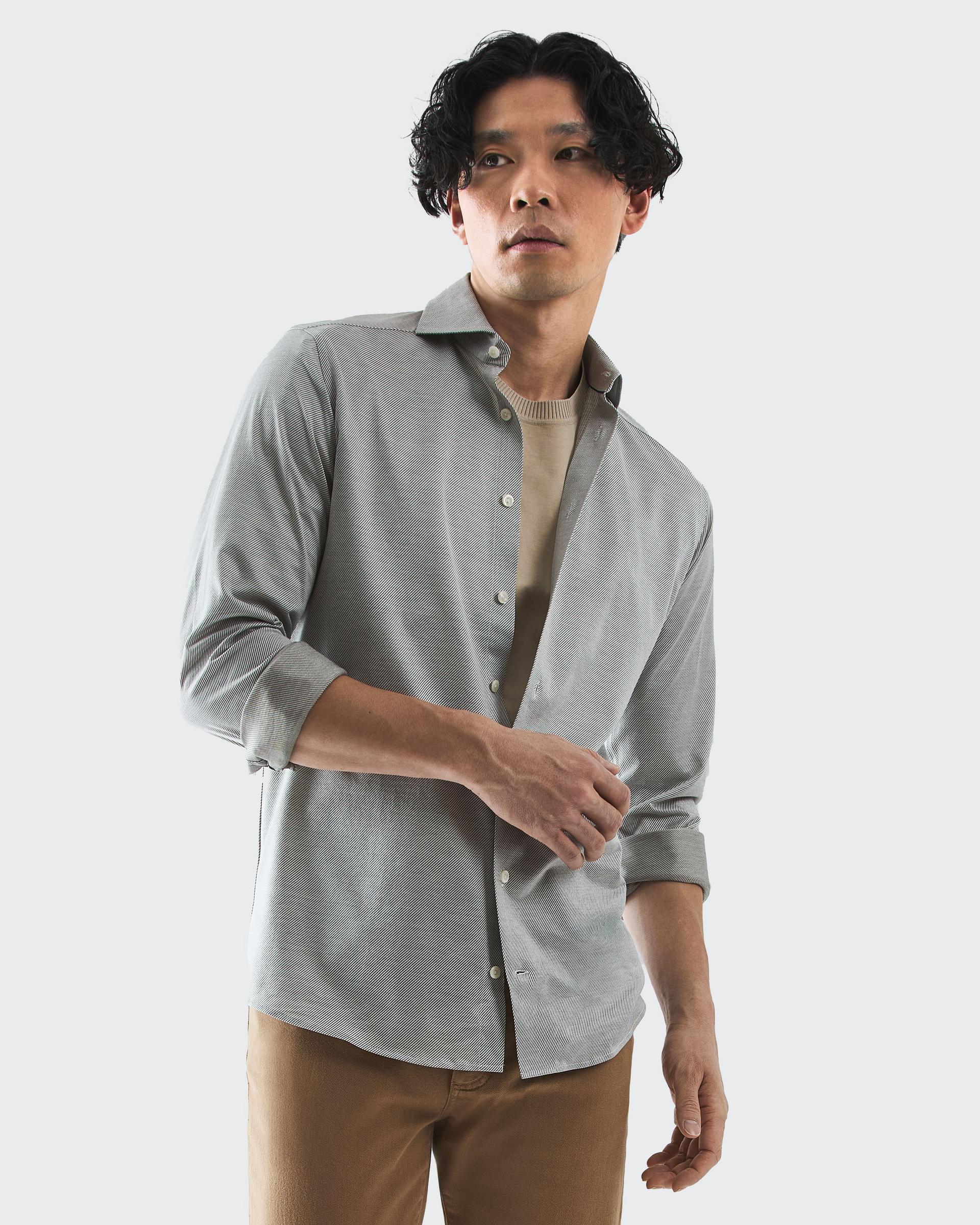 Male model wearing a grey casual shirt by Eton