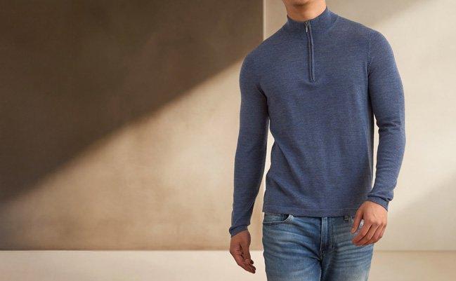 A man wearing Patrick Assaraf  fitted blue quarter-zip sweater