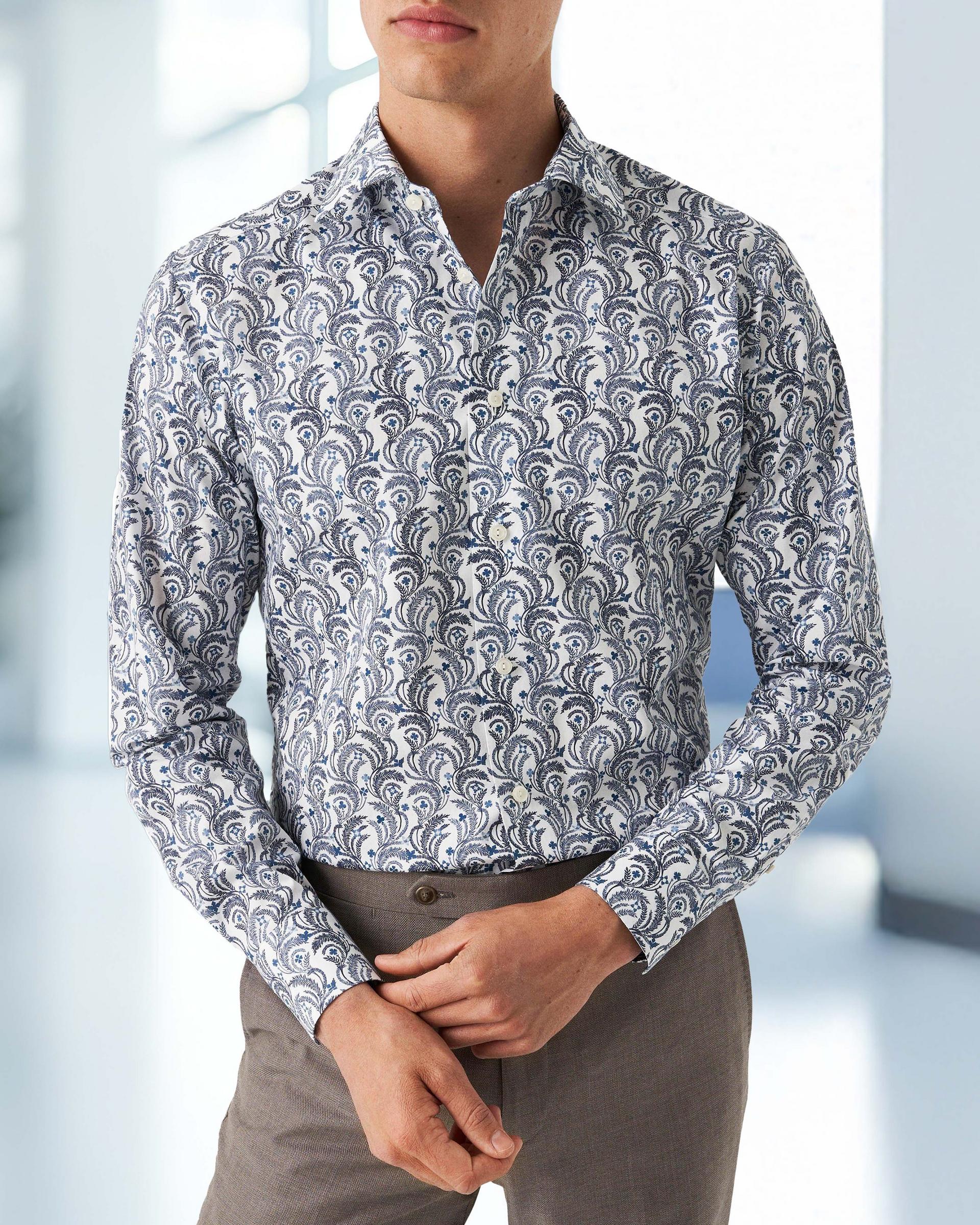 A man wearing a grey printed casual shirt by Eton