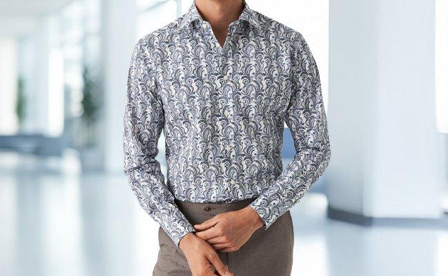 A man wearing a grey printed casual shirt by Eton