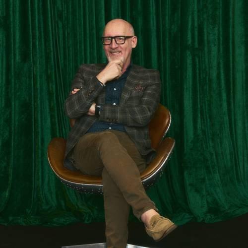 Male posing for a picture at Sharp x Harry Rosen event