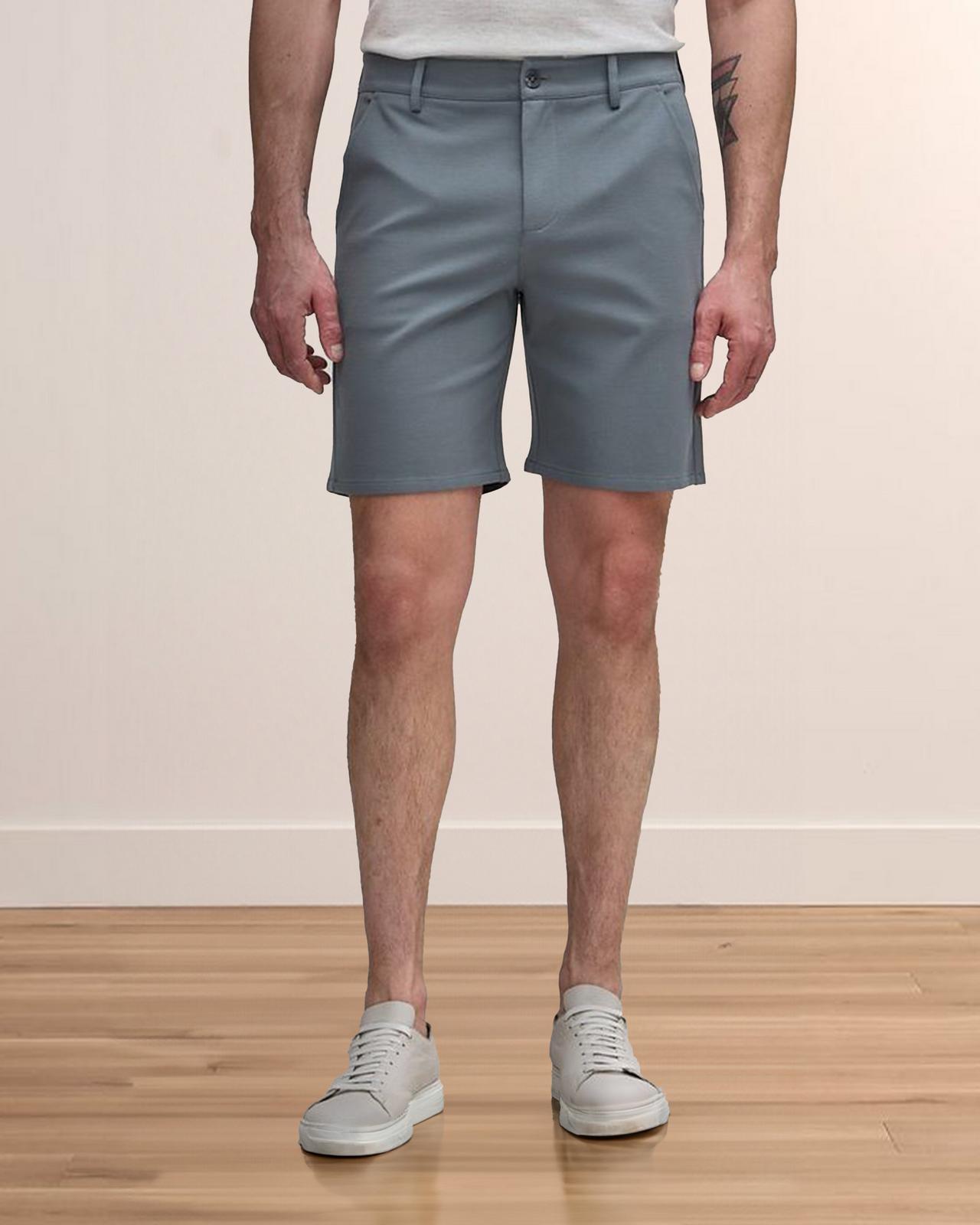 Male model wearing grey Patrick Assaraf shorts