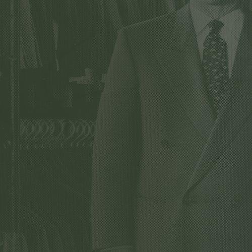 Mannequin wearing double breasted jacket, dress shirt and tie signifying made in Canada fashion