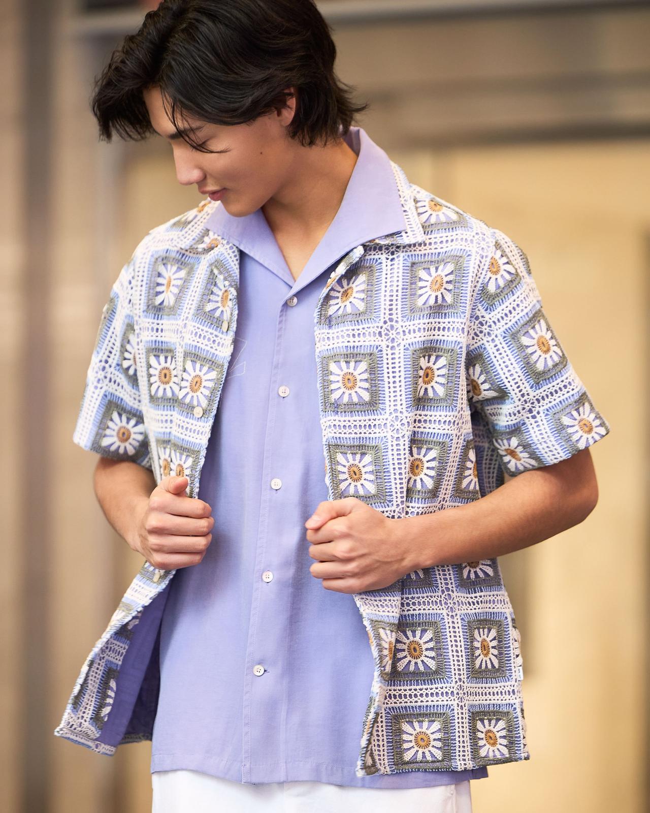 Male model wearing a floral purple casual shirt