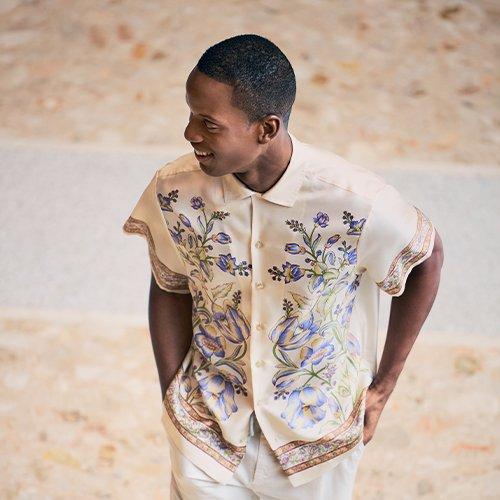 Male wearing floral casual shirt signifying floral print