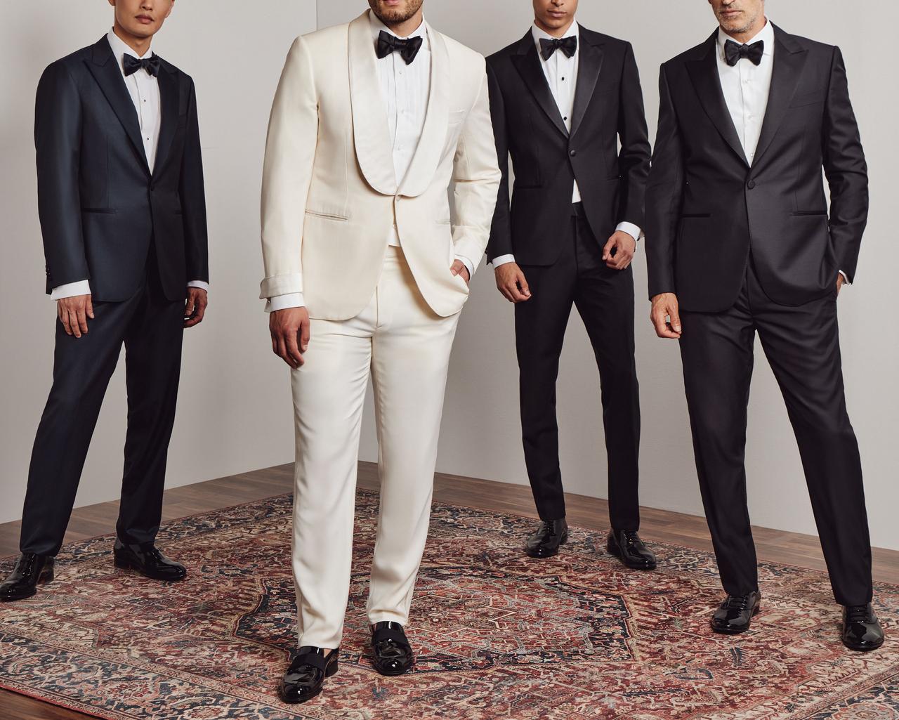 Groomsmen and groom wearing tuxedos for wedding