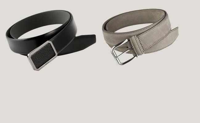 Two different types of belts on a beige background