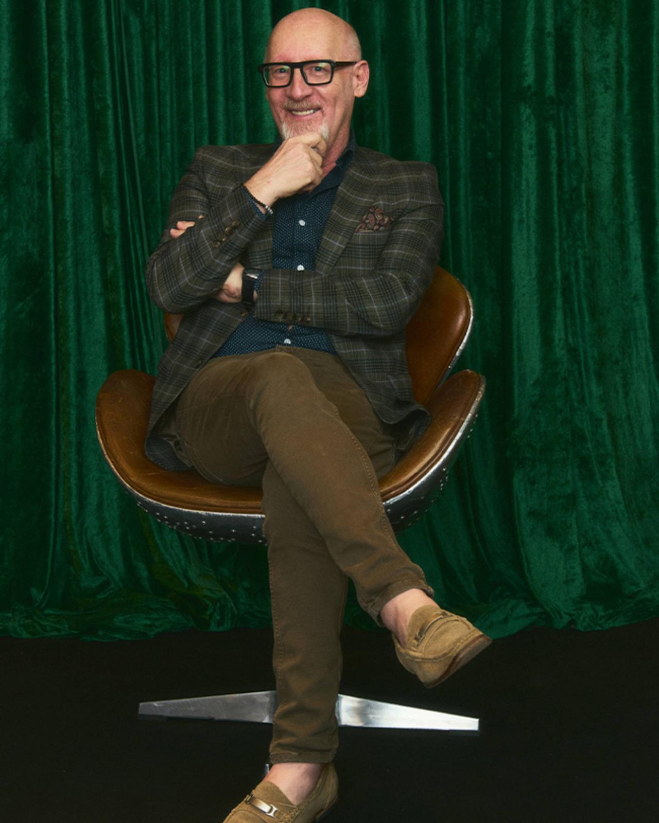 Man posing for a picture at Sharp X Harry Rosen event