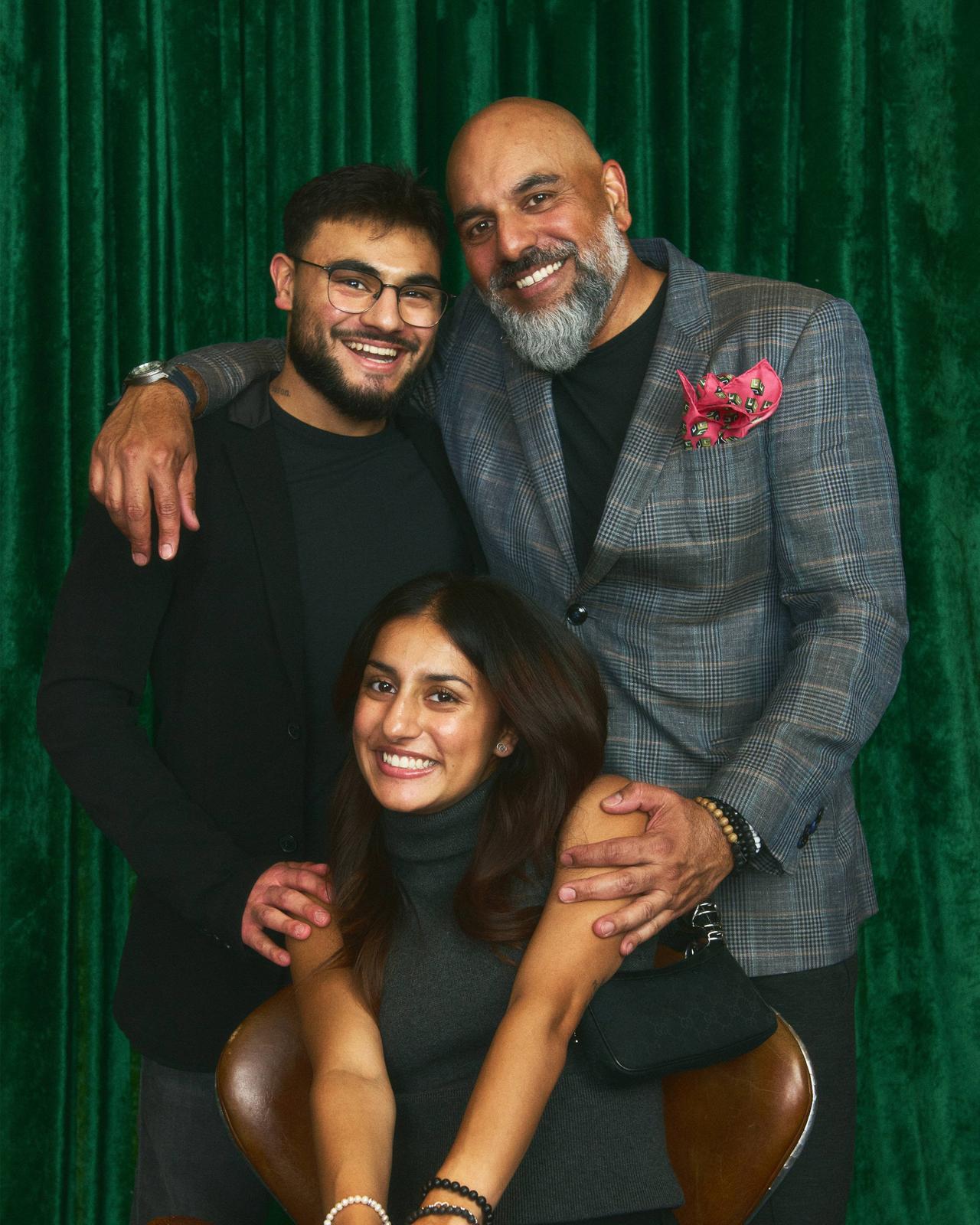 A family posing for a picture at Sharp X Harry Rosen event